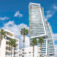 Modern skyscraper is being built, towering over traditional buildings with palm trees in Limassol, Cyprus